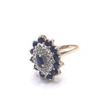 A 9carat gold ring set with a cluster pattern of s