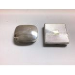 A silver pill box and a silver compact mirror/ pow
