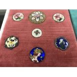 A collection of single enamel buttons including ar