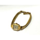 A ladies 9ct/18ct gold wristwatch (total weight 29