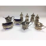 A collection of silver cruet sets. Shipping catego