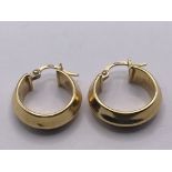 A pair of 18carat gold 750 marked hoop earrings. W