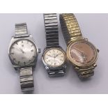 Three vintage gents watches a Tissot Roamer and Es