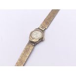 A 9carat gold ladies wrist watch with gold strap a
