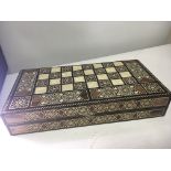 A Damascus type inlaid chess box with carved onyx