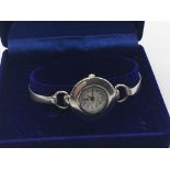 A silver cased ladies watch.