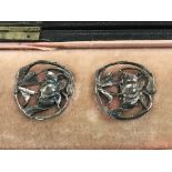 A cased set of Art nouveau buttons .
