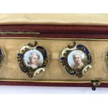A cased set of enamel buttons depicting 19 th cent