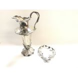 An early Silver Claret jug with handle. Hallmarked
