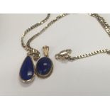 A 9 ct gold pendant inset with Lapis Lazuli on an
