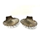 A pair of Silver Shell shaped dishes with pierced