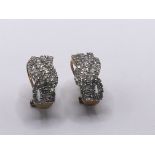 A pair of 9carat gold earrings set with small bril