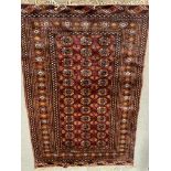 A eastern geometric design silk rug. 177 x 124cm