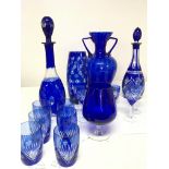 A collection of blue flash and cut glass and other