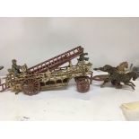 An interesting cast iron model of a horse drawer fire ladder with three horses and fireman. Length