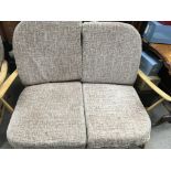 A Ercol two seater sofa and two matching open arm