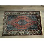 An Antique Persian rug. (D)- NO RESERVE