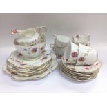 An Aynsley tea set with hand painted floral decora