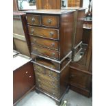 A pair of small reproduction mahogany chests of dr