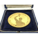 A 1964 Tokyo Olympics medallion silver gilt marked