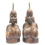 A pair of African carved wooden busts, approximate