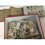 A collection of cigarette cards including thirty e