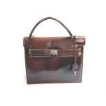 A vintage leather Kelly bag. Approximately 28cm wi