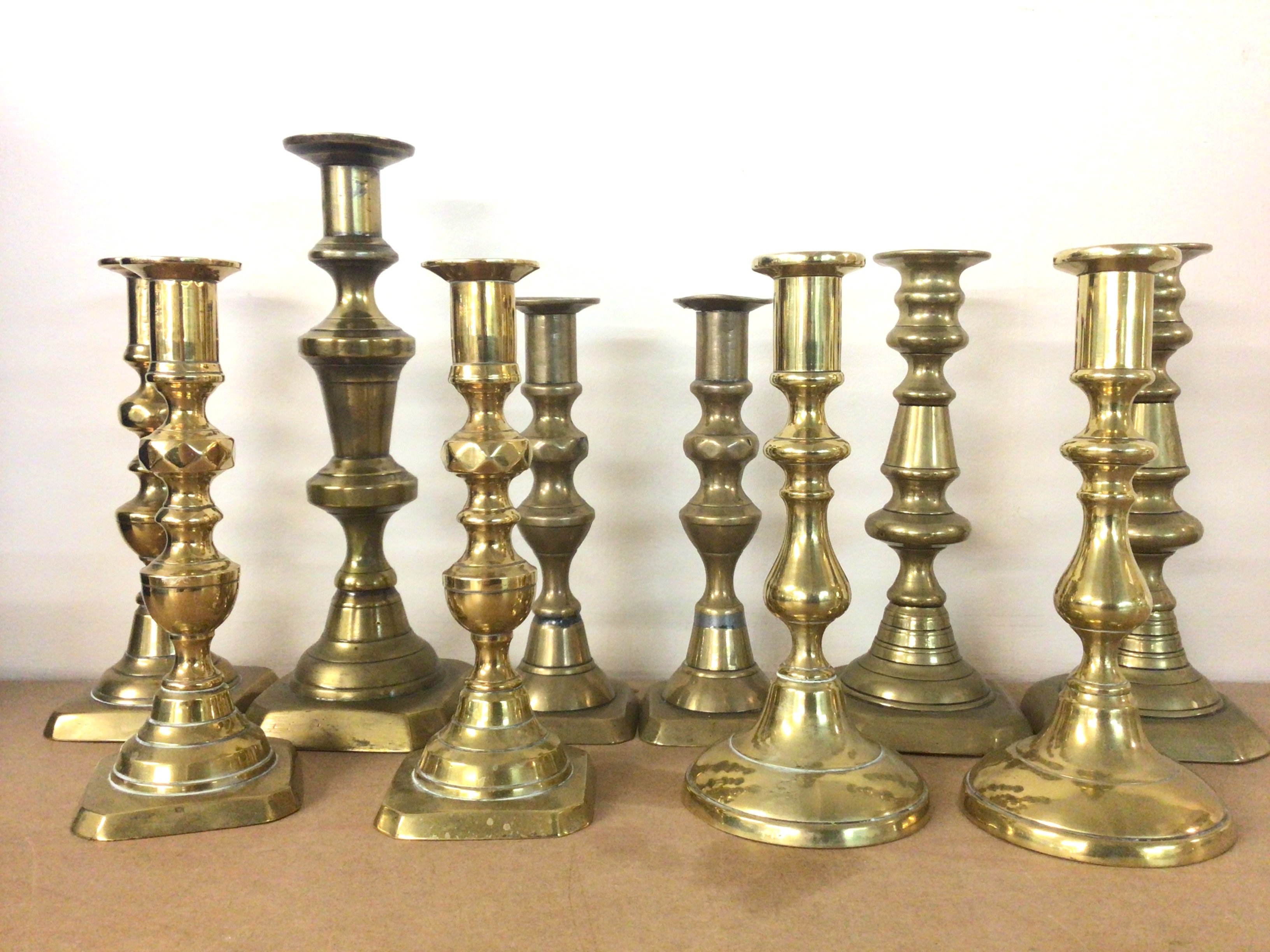 Various Victorian brass candlesticks including som