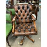 A reproduction design studded leather office chair