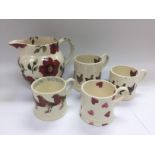 A rare Emma Bridgewater jug and four mugs (5). Shi