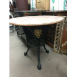 A Victorian cast iron pub table with later top. Ap
