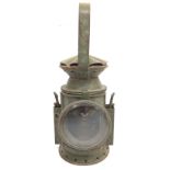 A green vintage oil lamp, 33cm tall. Postage cat D