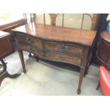 A mahogany bow fronted side table with four drawer