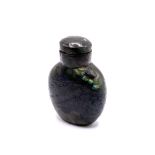 A polished labradorite snuff bottle with matching