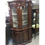 A Continental inlaid mahogany display cabinet with