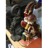 A painted cast iron Mr Punch door stop and a Victo