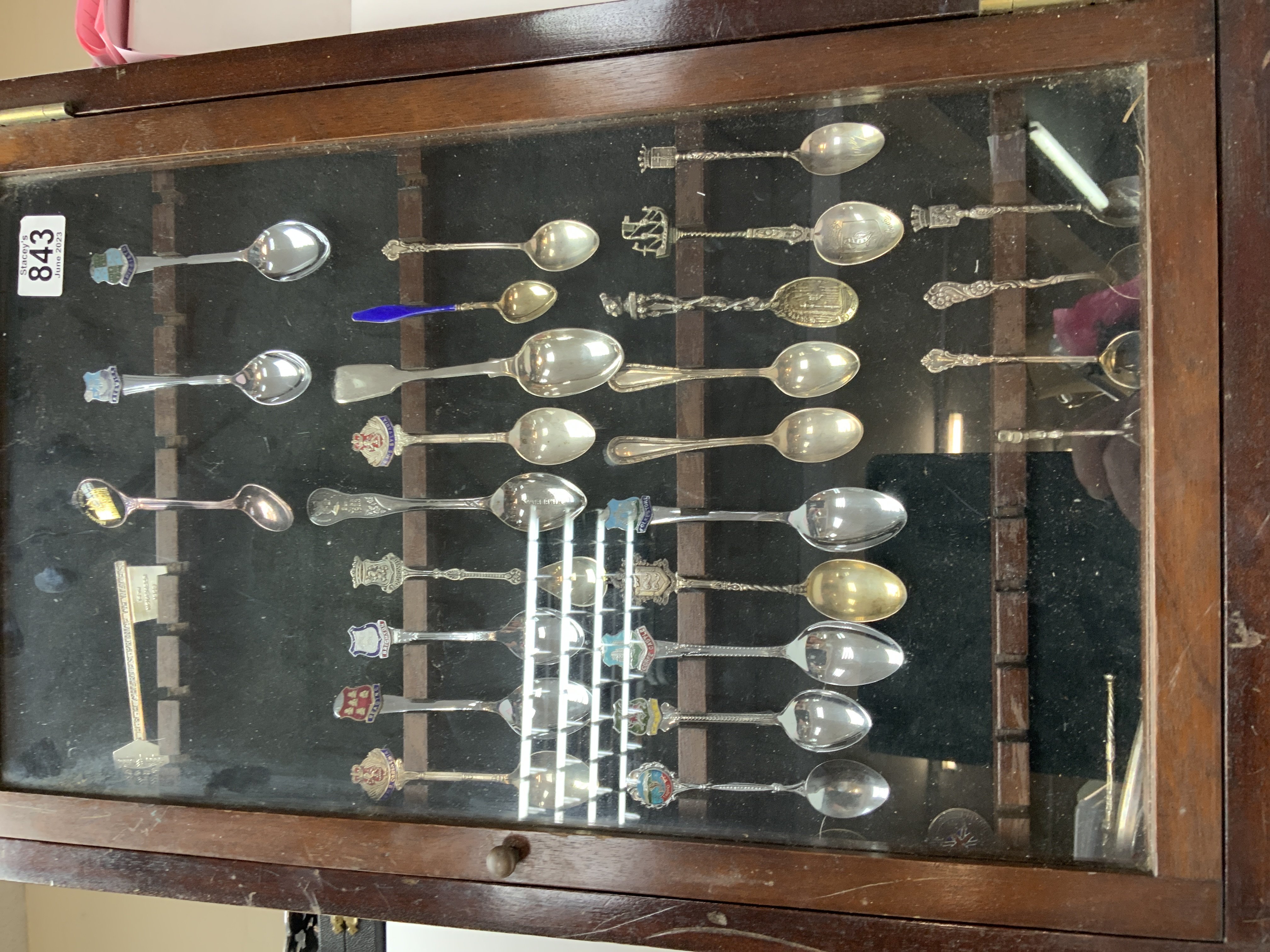 A case of silver and silver plated spoons.