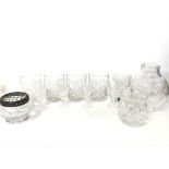 A set of cut glasses, a lidded glass jar, clear gl