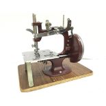 A cased sewing machine , postage cat C