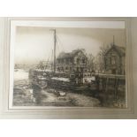 A framed etching of moored barge and low tide in a