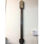 A mercury filled mahogany stick barometer.