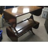 A pair of mahogany cross banded sofa tables with t