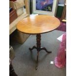 A mahogany occasional table with turned column sup