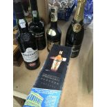 A collection of various alcohol in five boxes containing: gin , port brandy and wine ,