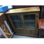 An oak bookcase with lead light doors, approx 93cm