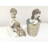 A Lladro figure of a dog in a washing basket and o