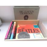 A collection of CD sets including The Beatles, Eri