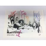 A fully signed photographic print of The Spice Gir