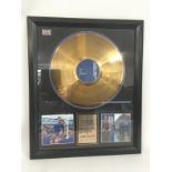 A framed gold disc for the Robbie Williams LP 'Sin