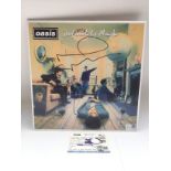 A signed 180g pressing of 'Definitely Maybe' by Oa